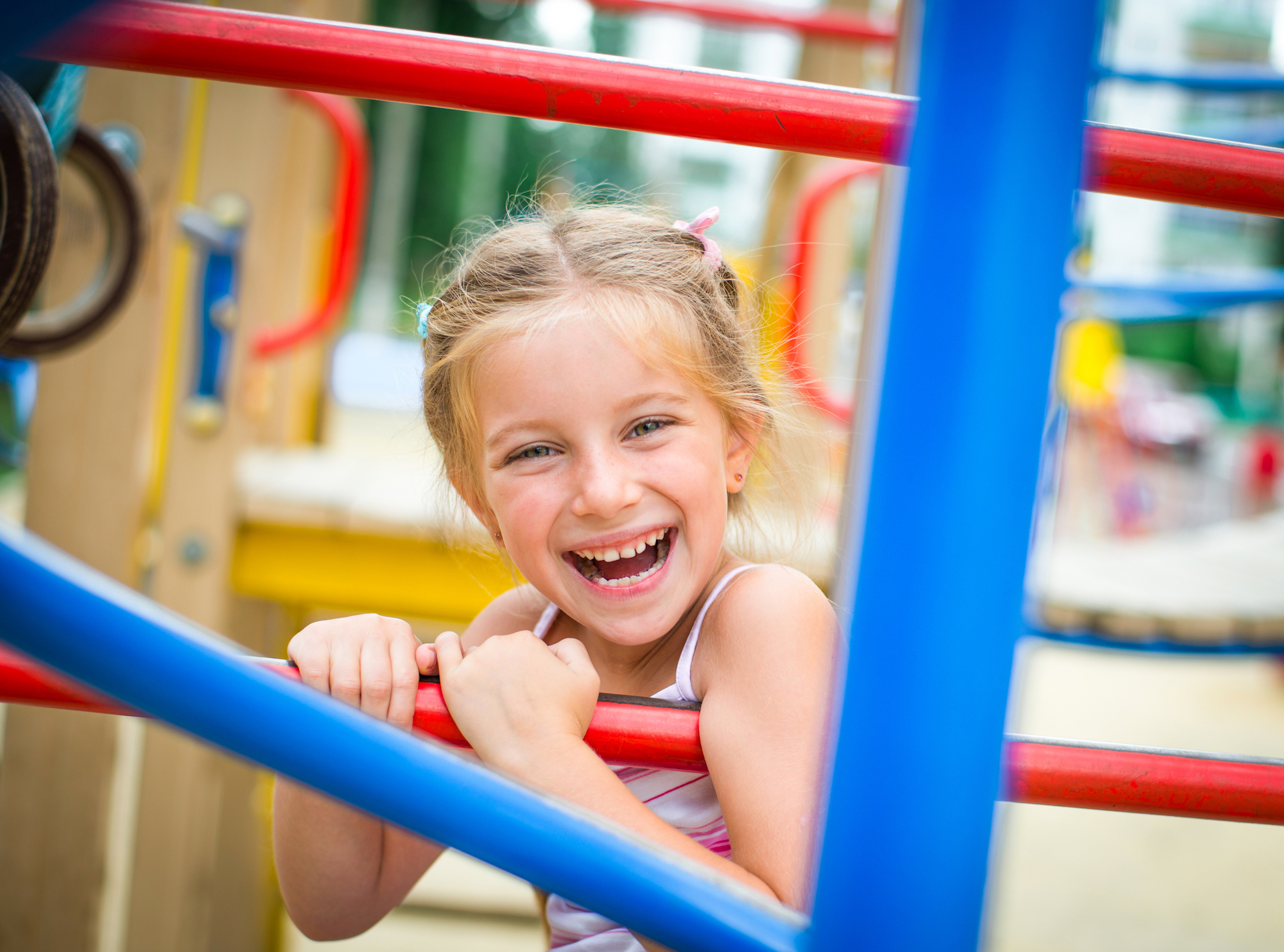 Little girl smiling on playground